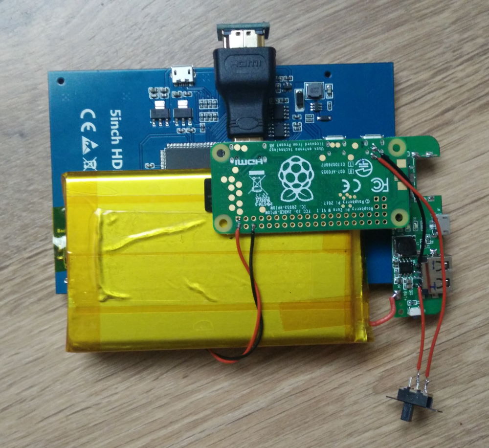 Photo of the insides of the power supply, showing the buck-boost converter and the laptop power supply