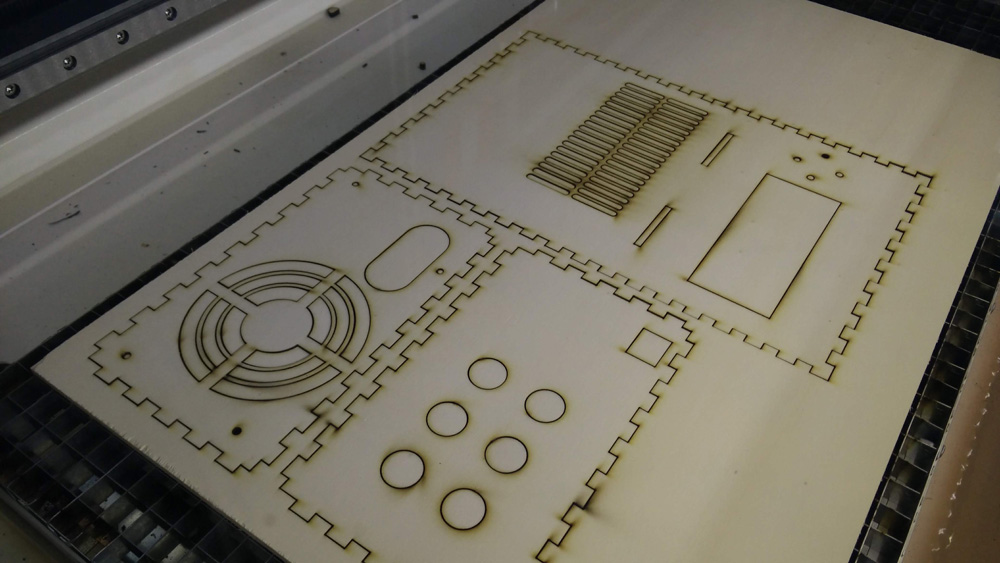 the lasercut enclosure parts in the lasercutter